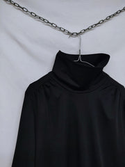 Turtleneck dress with ruffle hem