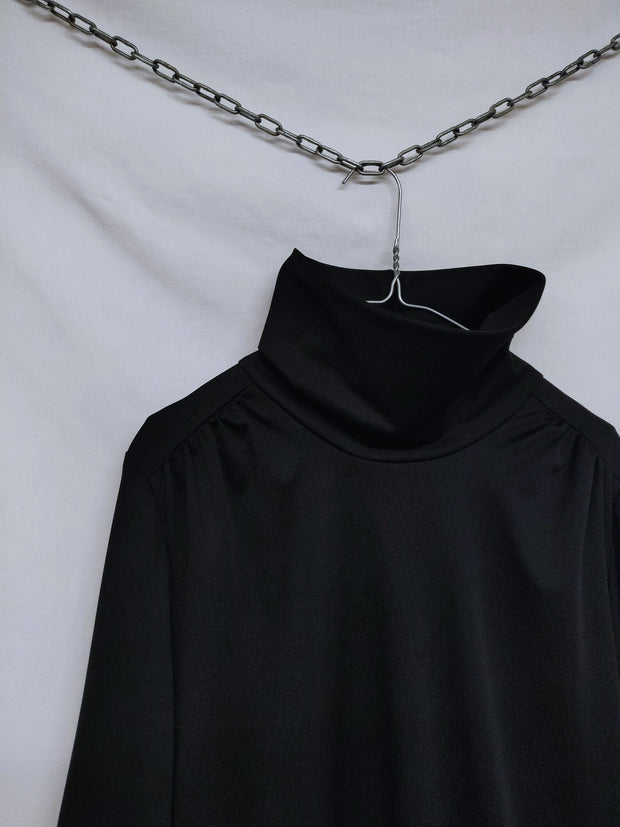 Turtleneck dress with ruffle hem