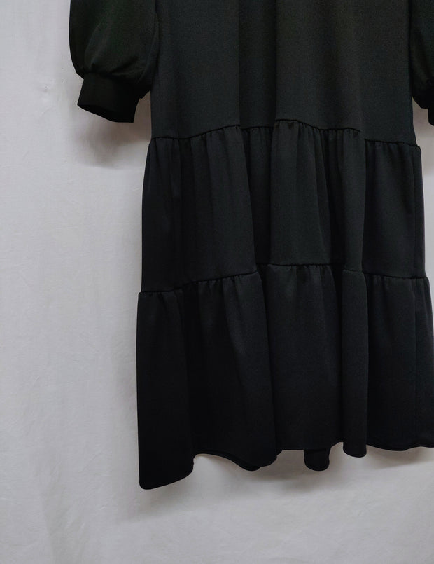 Turtleneck dress with ruffle hem